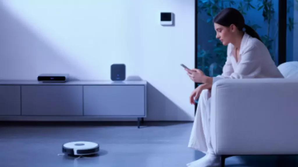 modern living room with smart home devices like smart plugs, lights, and robot vacuum controlled by phone